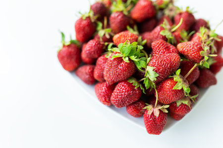 Ripe picked strawberries on the table. Collection of fresh organic strawberries. Delicious and sweet berryの写真素材