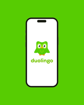 Kyiv, Ukraine - 03 June 2022: Owl Duolingo on Iphone 14 screen - vector illustration. Duolingo an American educational technology company. App on the smartphone for learning foreign languagesのeditorial素材