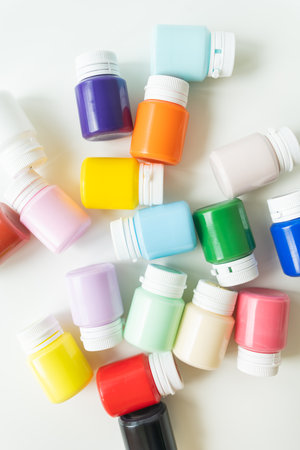 Banks of gouache, multi-colored acrylic paints isolated on white backgroundの写真素材