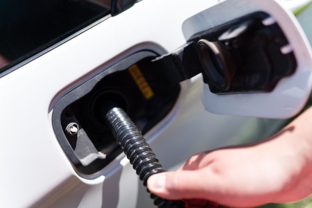 Refueling a car with fuel on the road, self-refueling, force majeure. Refueling from a canister. close-upの写真素材