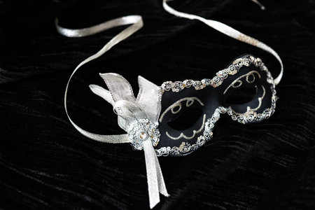 Carnival mask with a beautiful design on a black background. Chic and shine. Holiday and masquerade conceptの写真素材