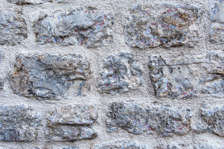 Close-up of a textured stone wall. An old houseの写真素材