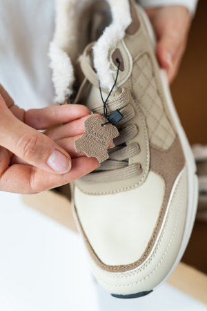 A small piece of genuine leather comes with an insulated sneaker for the winter season. Quality check before purchaseの写真素材