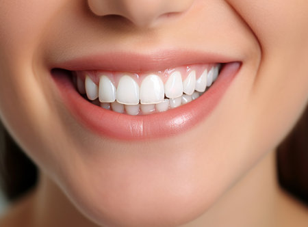 A close-up photo of a woman s smile with perfect white teeth. The concept of dentistry and oral careの素材