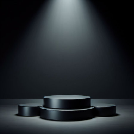 A three-tiered black podium on a gray background, illuminated by a spotlight for presentationの素材