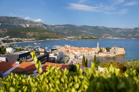Montenegro - Budva: Aerial view of the old town of Budva, the Adriatic sea and mountains