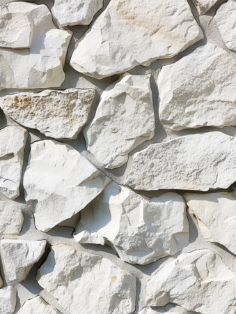 Detailed image of a white stone surface with natural cracks and a textured finishの素材