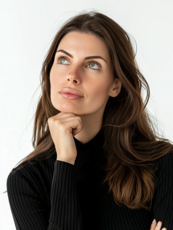 An intimate portrait of a brunette woman with piercing green eyes, her thoughtful expression inviting contemplation. Her subtle hand gesture adds to her enigmatic allureの素材