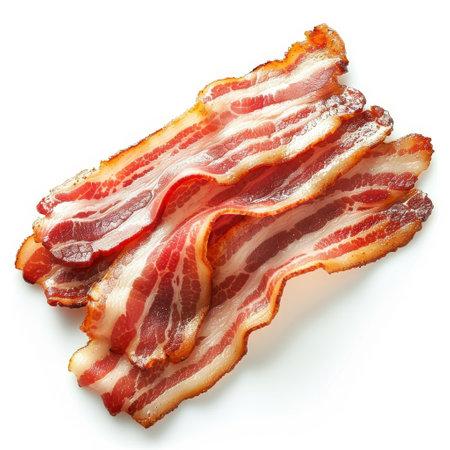 Crispy fried bacon strips isolated on a white background, top viewの素材