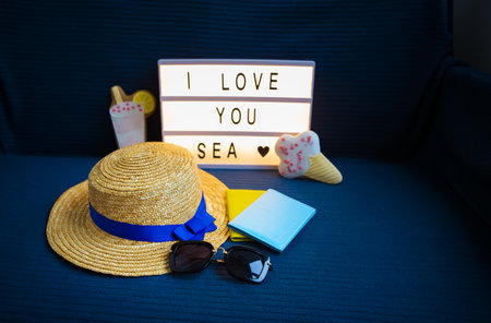 Layout for holidays-hat, passport, cocktail, sunglasses, inscription I love the sea.の写真素材