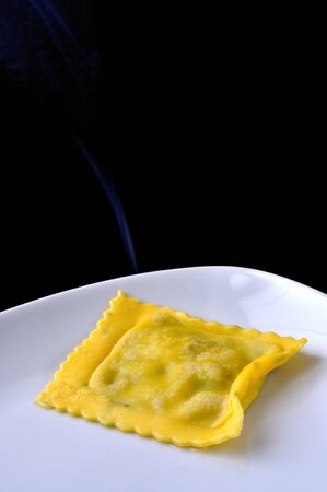 Cooked ravioli, italian egg pasta filled with ricotta and spinachの写真素材