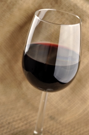 Glass of fine italian red wine, jute backgroundの写真素材