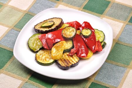 Grilled vegetables on dining tableの写真素材