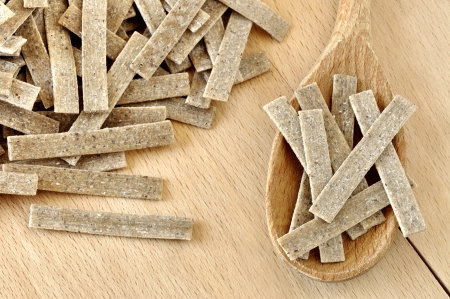 Pizzoccheri on a wooden chopping board, italian pasta, specialty of Valtellina, Italyの写真素材