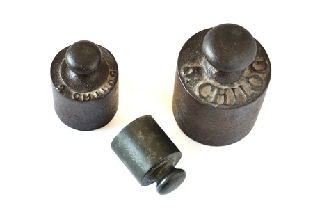 Old weight scale isolated on white の写真素材