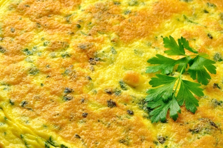 Frittata - italian omelette with parsley and parmesan cheese on a old wooden table, closeupの写真素材