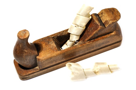 Old plane with wood shavings, isolated on whiteの写真素材