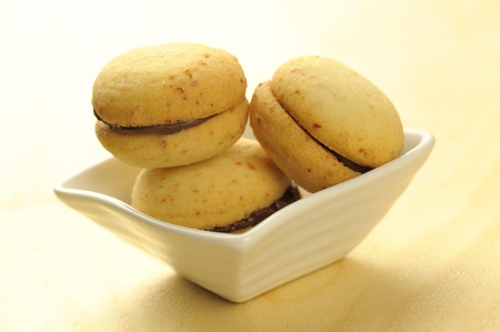 Baci di dama, chocolate-filled hazelnut cookies, traditional italian cookieの写真素材