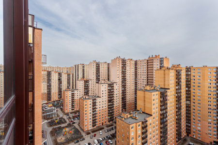 Multi-story residential buildings in a dense development, top view of courtyards and parking lots. Urban landscape.の写真素材