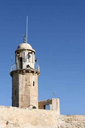 A old Muslim minaret located on the Mount of Olives in the city of Jerusalem, Israel uses megaphones to call Islam worshipers to prayer.の写真素材