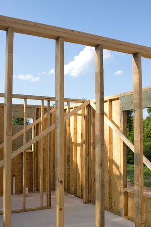 Stud wall construction for a new home built of wood with a concrete slab floor.の写真素材