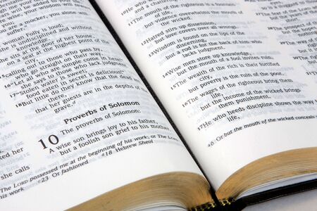 Holy Bible is opened to the tenth chapter of Solomon.の写真素材