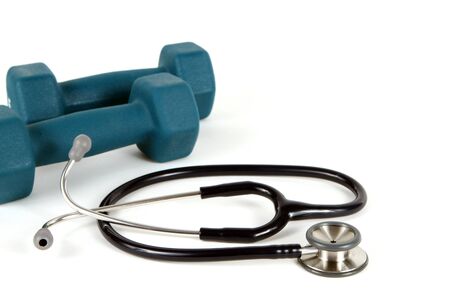 Stethoscope and resistance training weights together to conceptualize a healthy lifestyle.の写真素材