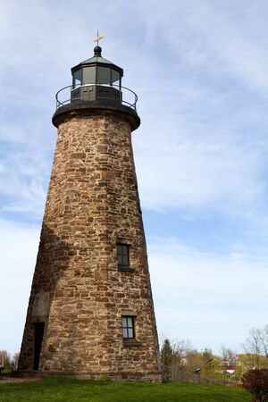 Charlotte Genesee Lighthouse, built in 1822, is located on Lake Ontario in Rochester, New York, USA was deactivated in 1881 and is now a museum owned by the county.のeditorial素材
