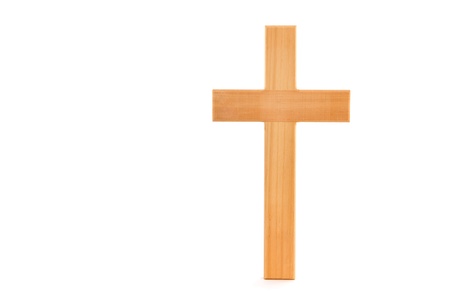 Wooden cross with grain standing on a white background の写真素材