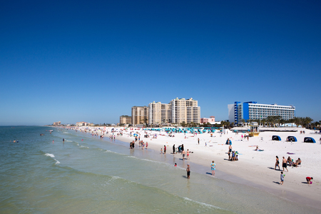 CLEARWATER BEACH, FLORIDA - FEBRUARY 12, 2017: Vacationers play on Clearwater Beach, Florida, USA, on February 12, 2017.のeditorial素材