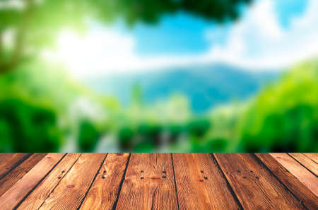 Wood Table with Blurred Nature Backgroundの写真素材