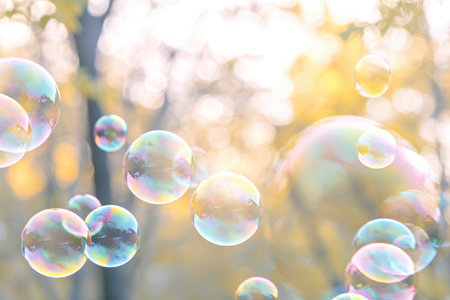Colorful soap bubbles in the air and blurred bokeh nature background Generative AI Illustration.の素材