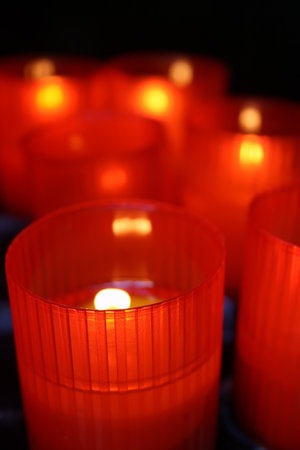 Candles lit in red plastic cups moment of praise and worship.の写真素材