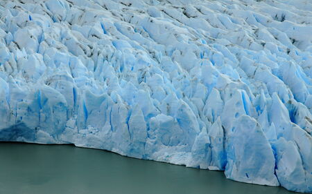 A wall of ice on the front of the heavily crevassed Glacier Grey in Torres del Paine National Park,...