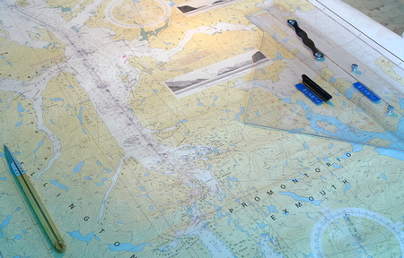 A ships paper navigation chart showing an area off the coast of Chile, and navigation associated tools.のeditorial素材