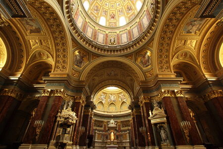 Ornate architecture, arches, domes, and golden decoration in the interior of St. Stephen\'s Basilica...