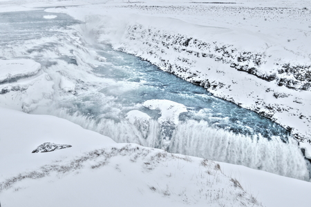 The famous Gulfoss waterfall, surrounded by a snow covered landscape in the middle of winter. Iceland.の写真素材