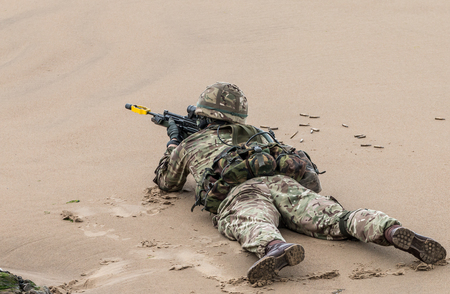 British Royal Marine Commandos perform a beach assault demonstration for the public during the 2015 Sunderland Airshow.のeditorial素材