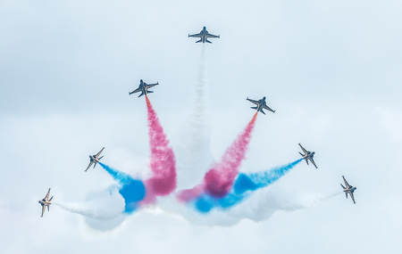 Aircraft from the Republic of Korea's Black Eagles aerobatic display team fly in 'V' formation during the 2016 Singapore Airshow. The airshow is the biggest of its kind in Asia.のeditorial素材
