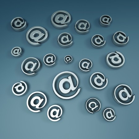 silver email symbols floating on blue backgroundの写真素材