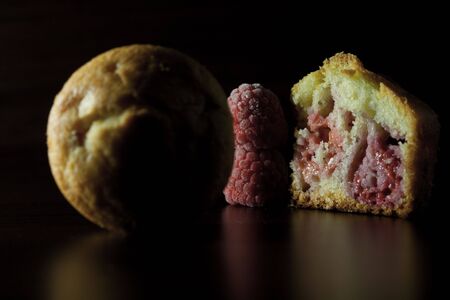 That is a delicious raspberry muffin homemade.の写真素材
