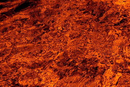 Orange swirling water abstract background.の写真素材