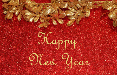 Happy New Year sparkling gold and red background.の写真素材