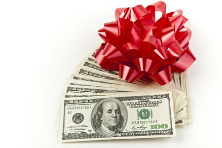 happy holiday gift stack of money with red bow の写真素材