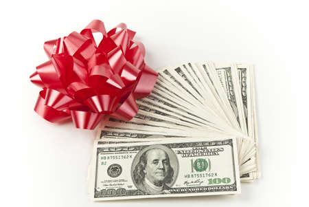 centered happy holidays pile of moneyの写真素材