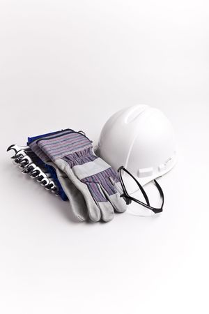 vertical centered  hard hat leather gloves safety glasses wrenchesの写真素材