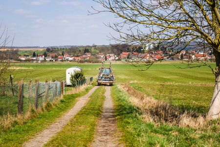 tractor in the field in europeの写真素材