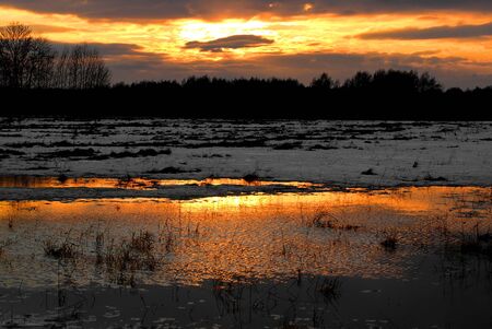 Reflection of a beautiful sunset in the eveningの写真素材