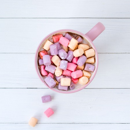Christmas cocoa with marshmallow in a pink cup