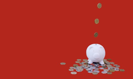 piggy bank with money and coins, for illustrations of articles on economics, finance, family budget, purchases, copy spaceの写真素材